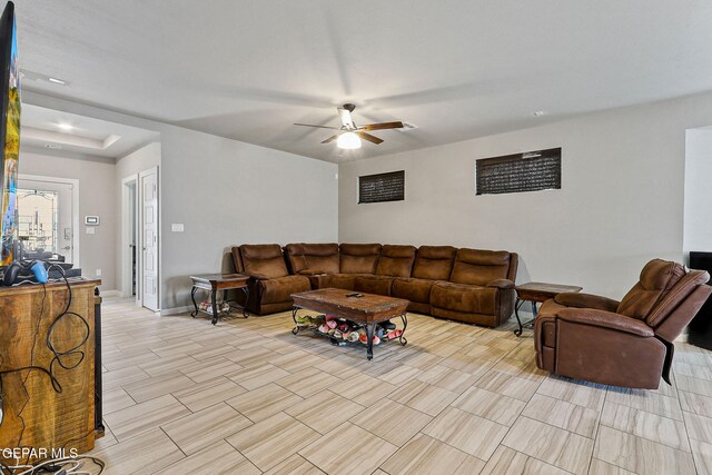 13925 Lago Vista Ave, Horizon City, TX 79928 - living room featuring a ceiling fan and baseboards