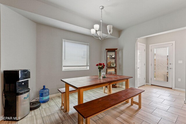 13925 Lago Vista Ave, Horizon City, TX 79928 - dining space with a chandelier, baseboards, and wood finish floors