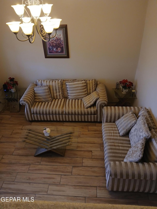 405 Santorini Ct, Socorro, TX 79927 - living area featuring a chandelier and wood finished floors