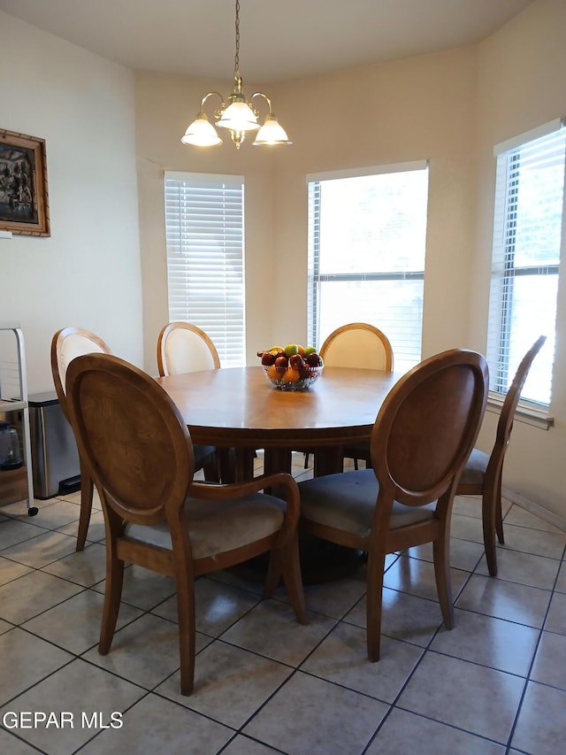 405 Santorini Ct, Socorro, TX 79927 - dining space featuring light tile patterned floors and a chandelier