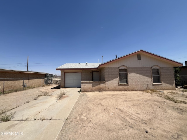 9129 Plymouth Dr, El Paso, TX 79907 - ranch-style house with brick siding, driveway, and an attached garage