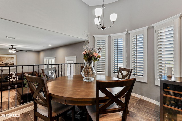 12517 Winners Cir, El Paso, TX 79928 - dining room with wood finished floors, a ceiling fan, baseboards, and a chandelier