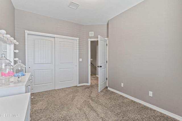 12517 Winners Cir, El Paso, TX 79928 - unfurnished bedroom featuring light carpet, a closet, and baseboards