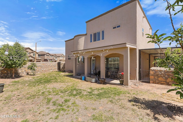 12517 Winners Cir, El Paso, TX 79928 - rear view of property with a patio area and stucco siding