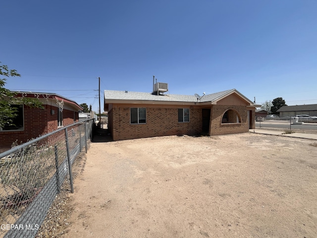 9145 Plymouth Dr, El Paso, TX 79907 - rear view of house featuring brick siding and central air condition unit