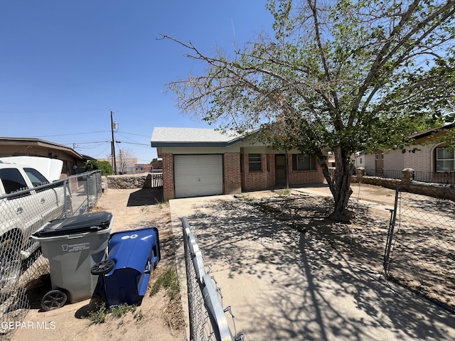 9217 Plymouth Dr, El Paso, TX 79907 - view of front of property with brick siding, a garage, and driveway