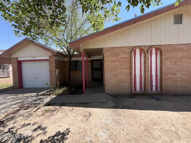 724 Haverhill Rd, El Paso, TX 79907 - view of front of home with a garage, brick siding, and concrete driveway