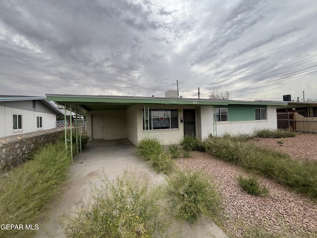 412 Indian Pl, El Paso, TX 79907 - view of front of home with an attached carport, concrete driveway, and brick siding