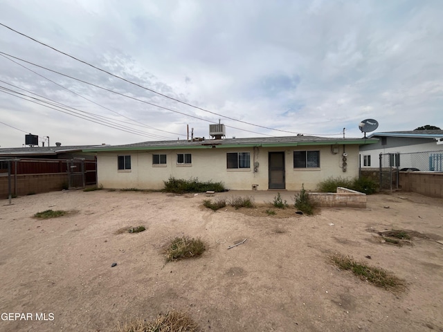 412 Indian Pl, El Paso, TX 79907 - rear view of property with central AC and brick siding