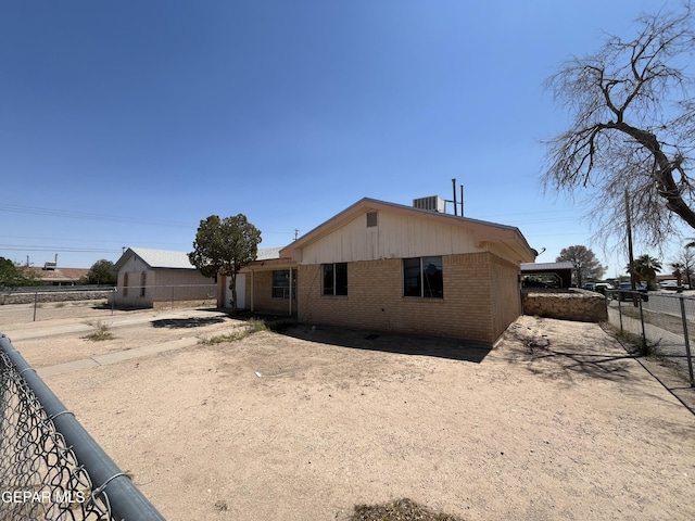 732 Jamestown Rd, El Paso, TX 79907 - back of house with brick siding, a fenced backyard, and cooling unit