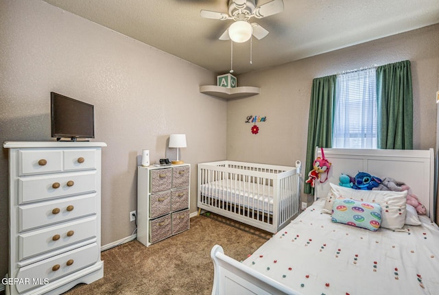 3844 Loma Cortez Dr, El Paso, TX 79938 - carpeted bedroom featuring a crib and a ceiling fan
