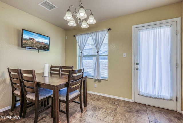 3844 Loma Cortez Dr, El Paso, TX 79938 - dining area featuring a chandelier and baseboards