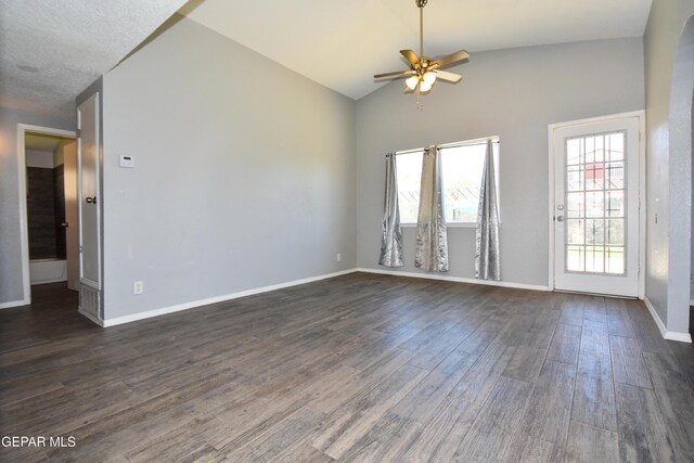 10824 Obsidian St, El Paso, TX 79924 - spare room featuring ceiling fan, plenty of natural light, vaulted ceiling, and dark wood-style flooring