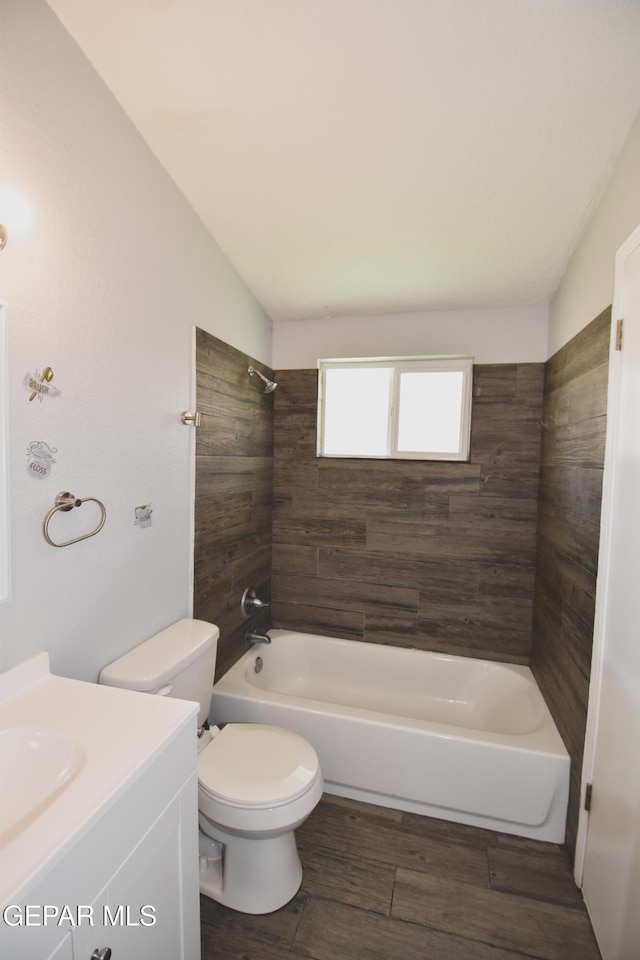 10824 Obsidian St, El Paso, TX 79924 - full bathroom featuring toilet, shower / tub combination, vanity, and wood finished floors