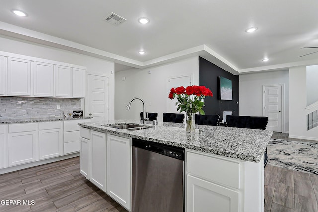 12816 Linstead Ave, El Paso, TX 79928 - kitchen with dishwasher, a sink, an island with sink, light wood-style floors, and recessed lighting