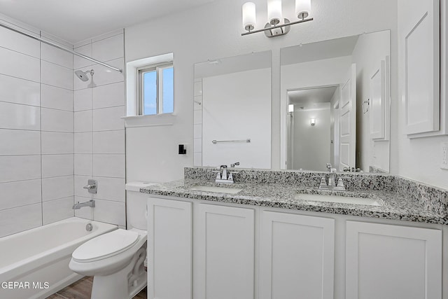 12816 Linstead Ave, El Paso, TX 79928 - bathroom featuring toilet, double vanity, and  shower combination