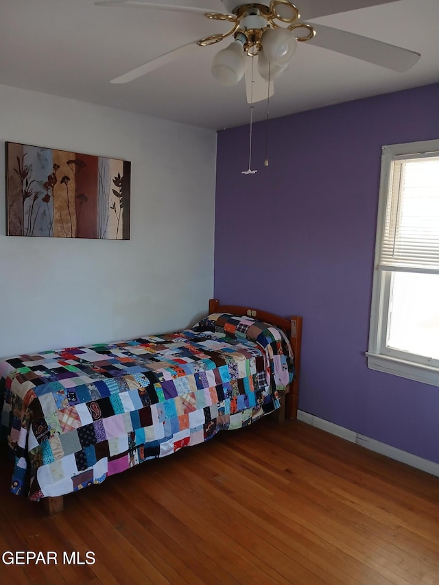 1700 Wainwright Dr, El Paso, TX 79903 - bedroom with wood finished floors, a ceiling fan, and baseboards