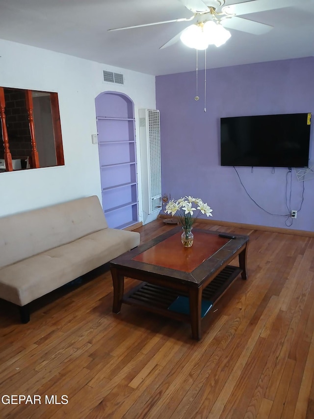 1700 Wainwright Dr, El Paso, TX 79903 - living area with a heating unit, light wood-style floors, and a ceiling fan