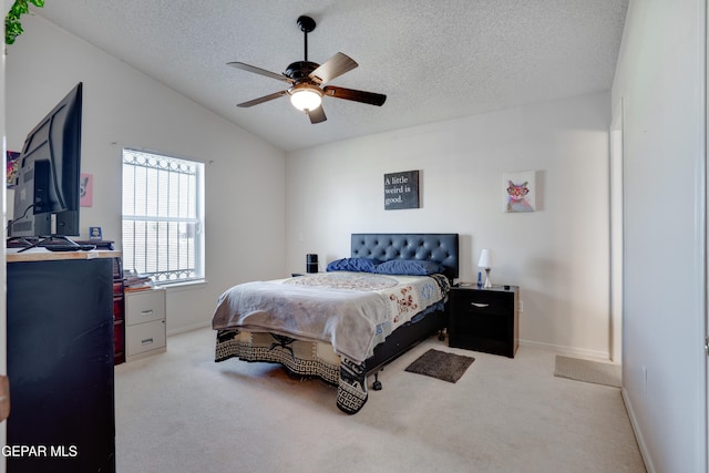 7930 Howard St, El Paso, TX 79904 - carpeted bedroom featuring a textured ceiling, vaulted ceiling, baseboards, and a ceiling fan