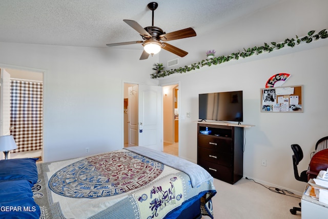 7930 Howard St, El Paso, TX 79904 - bedroom with light colored carpet, vaulted ceiling, a ceiling fan, and a textured ceiling