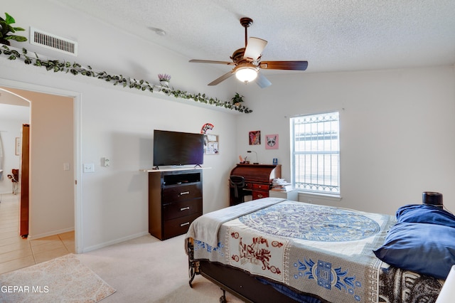 7930 Howard St, El Paso, TX 79904 - bedroom featuring a textured ceiling, light colored carpet, a ceiling fan, and baseboards