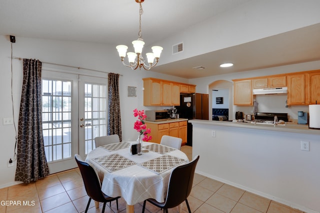 7930 Howard St, El Paso, TX 79904 - dining room with a chandelier, healthy amount of natural light, arched walkways, and light tile patterned floors