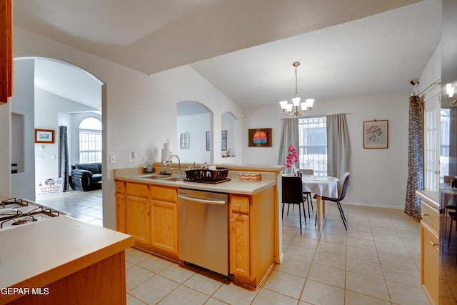 7930 Howard St, El Paso, TX 79904 - kitchen featuring stainless steel dishwasher, a sink, light countertops, a chandelier, and arched walkways