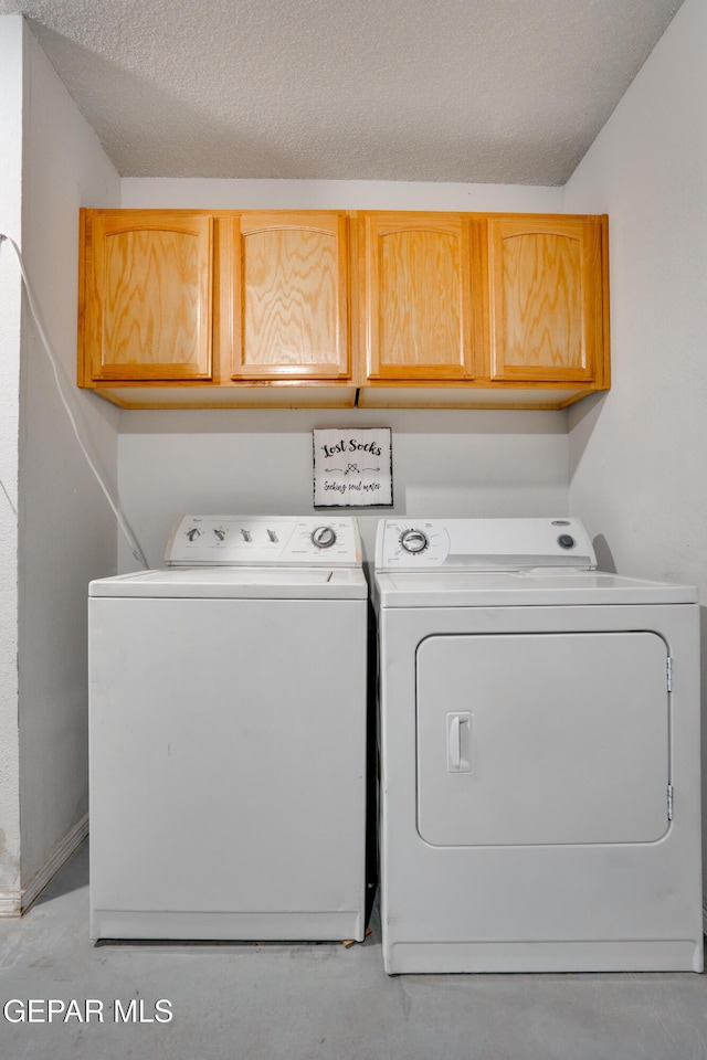 7930 Howard St, El Paso, TX 79904 - washroom with cabinet space, independent washer and dryer, and a textured ceiling