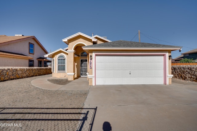 7930 Howard St, El Paso, TX 79904 - single story home featuring stucco siding, concrete driveway, and a garage