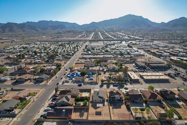 7930 Howard St, El Paso, TX 79904 - aerial overview of property's location featuring a mountain backdrop and nearby suburban area