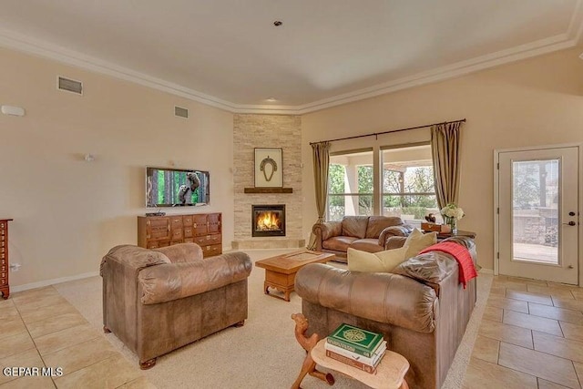 6365 Franklin Trail Dr, El Paso, TX 79912 - living room featuring light tile patterned flooring, crown molding, and a stone fireplace