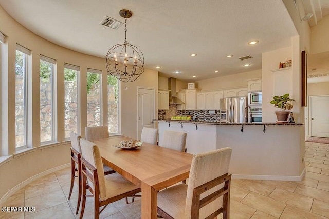 6365 Franklin Trail Dr, El Paso, TX 79912 - dining space with light tile patterned floors, recessed lighting, and a chandelier