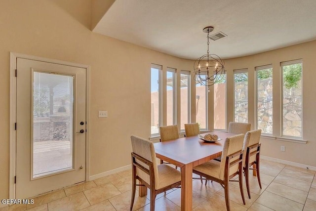 6365 Franklin Trail Dr, El Paso, TX 79912 - dining space with light tile patterned floors and a chandelier
