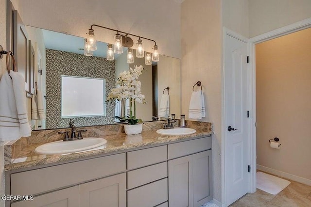 6365 Franklin Trail Dr, El Paso, TX 79912 - bathroom with double vanity and baseboards