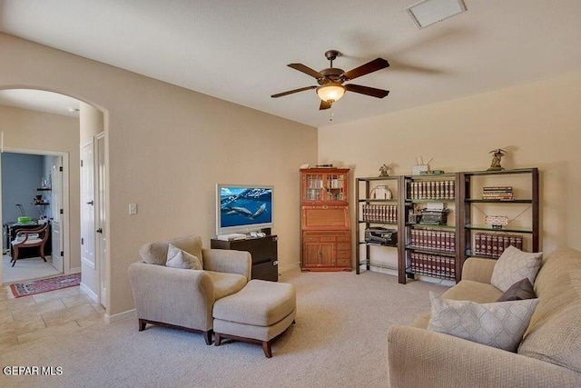 6365 Franklin Trail Dr, El Paso, TX 79912 - living room featuring arched walkways, a ceiling fan, and light colored carpet