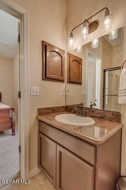 6365 Franklin Trail Dr, El Paso, TX 79912 - bathroom with vanity and a shower