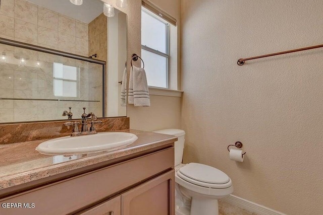 6365 Franklin Trail Dr, El Paso, TX 79912 - bathroom featuring tiled shower, vanity, and a textured wall