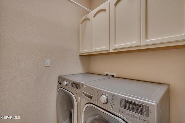 6365 Franklin Trail Dr, El Paso, TX 79912 - laundry room featuring independent washer and dryer and cabinet space