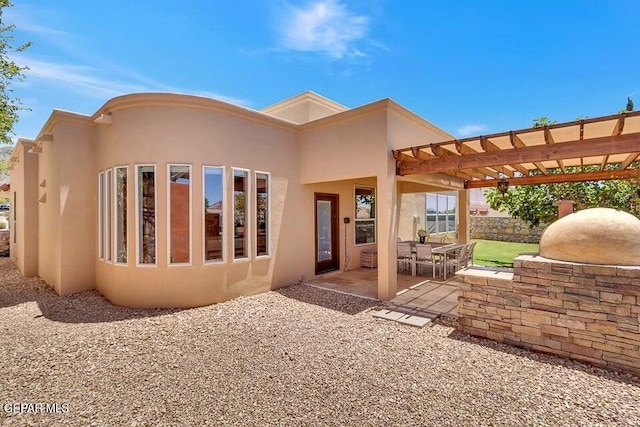 6365 Franklin Trail Dr, El Paso, TX 79912 - back of property featuring stucco siding, a patio, and a pergola