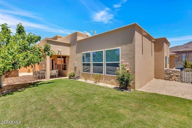 6365 Franklin Trail Dr, El Paso, TX 79912 - back of property featuring a patio area and stucco siding