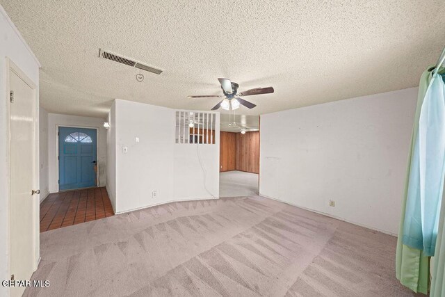 5033 Royal Dr, El Paso, TX 79924 - unfurnished room with carpet, a ceiling fan, and a textured ceiling