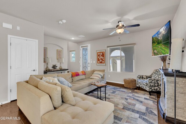 6716 Red Canyon Sage Ln, El Paso, TX 79912 - living room featuring wood finished floors, a ceiling fan, healthy amount of natural light, and baseboards