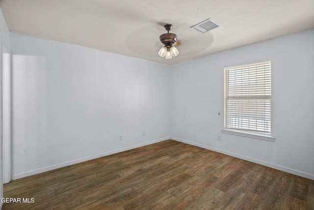 12008 Braveheart Ave, El Paso, TX 79936 - unfurnished room with dark wood finished floors, baseboards, and a ceiling fan