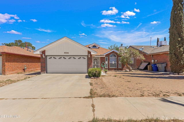12119 Quail Harvest Ln, El Paso, TX 79936 - ranch-style house with a garage, brick siding, and driveway
