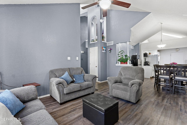 12119 Quail Harvest Ln, El Paso, TX 79936 - living room featuring a ceiling fan, dark wood-style flooring, lofted ceiling, and baseboards