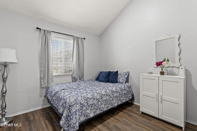12119 Quail Harvest Ln, El Paso, TX 79936 - bedroom with wood finished floors, lofted ceiling, baseboards, and a textured ceiling