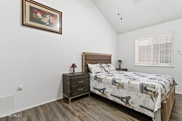 12119 Quail Harvest Ln, El Paso, TX 79936 - bedroom featuring lofted ceiling, dark wood finished floors, and baseboards