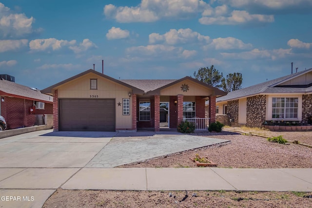 3303 Ward Robert Pl, El Paso, TX 79936 - ranch-style home featuring a porch, an attached garage, driveway, and brick siding