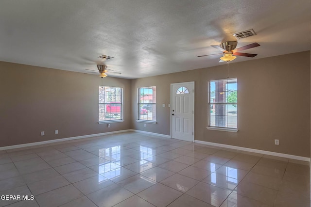 3303 Ward Robert Pl, El Paso, TX 79936 - foyer entrance with ceiling fan, plenty of natural light, baseboards, and a textured ceiling