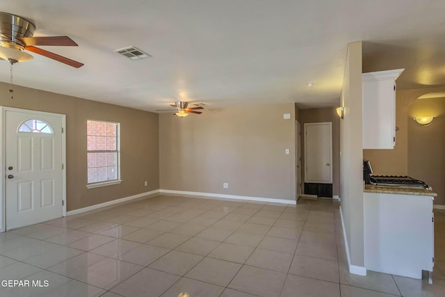 3303 Ward Robert Pl, El Paso, TX 79936 - unfurnished living room with ceiling fan, baseboards, and light tile patterned floors